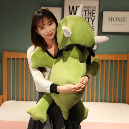 SQEQE giant triceratops stuffed animal hugged by an adult at a desk