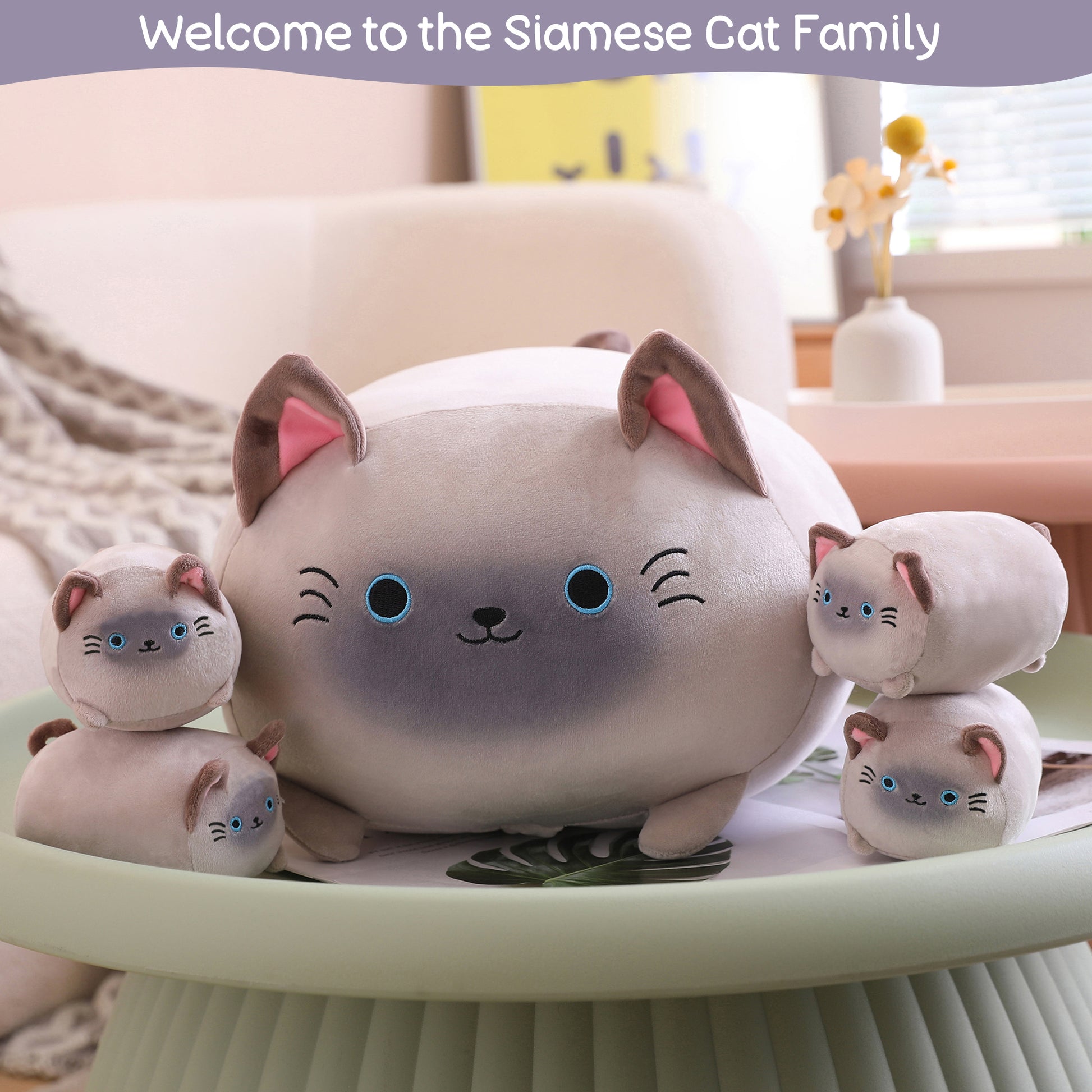 SQEQE Siamese cat stuffed animal with babies shown in a home product display with four baby plush toys