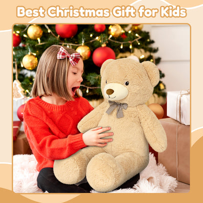 SQEQE giant teddy bear stuffed animal held by a child near a Christmas tree