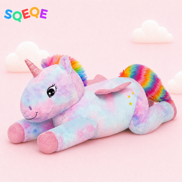 SQEQE giant unicorn plush pillow shown in a branded studio product display
