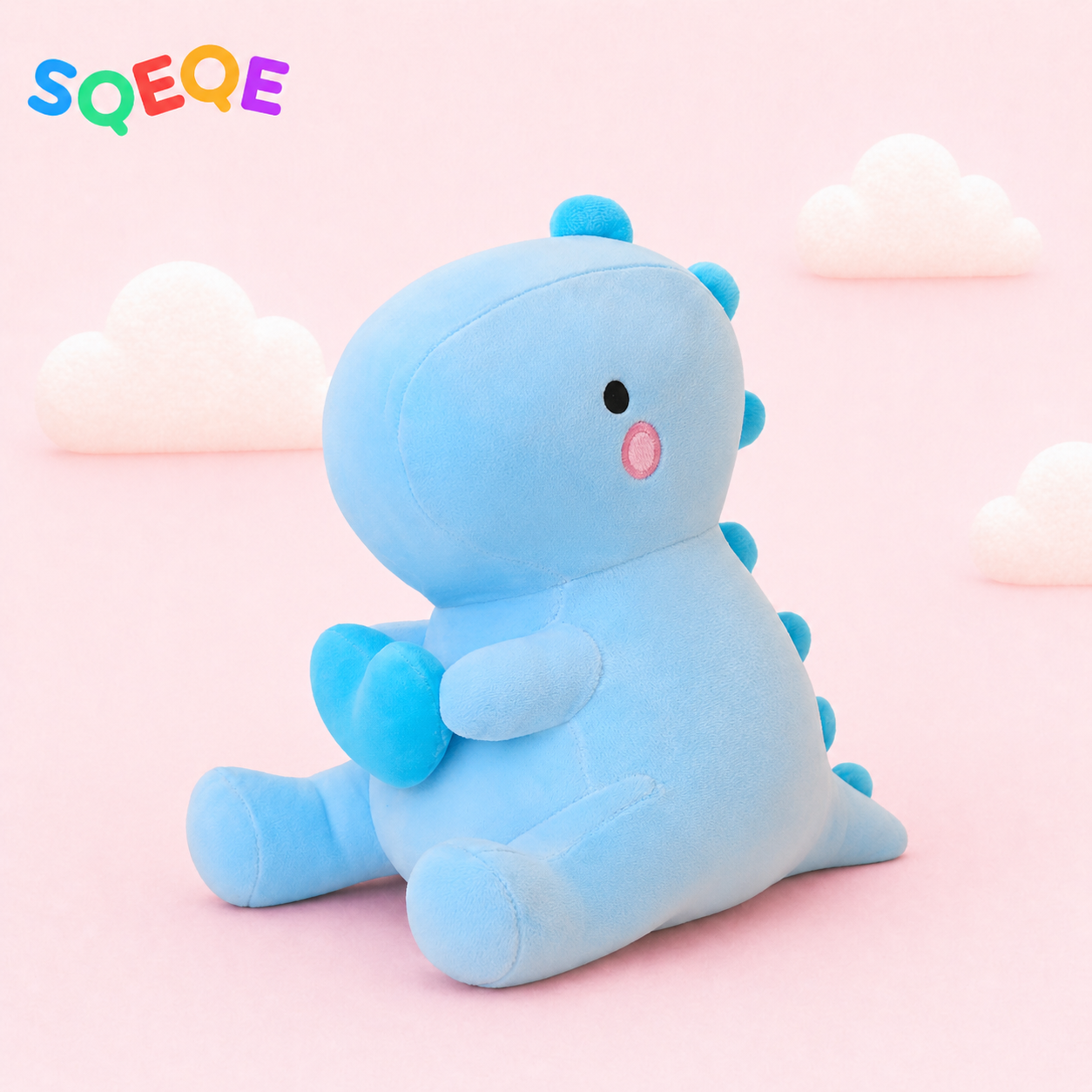 SQEQE dinosaur plush pillow shown in a second branded studio product display
