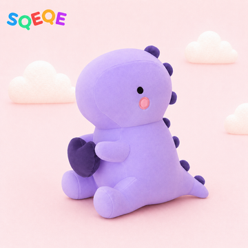 SQEQE dinosaur plush pillow shown in a branded studio product display
