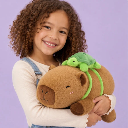 Child holding a brown capybara plush toy against a purple background