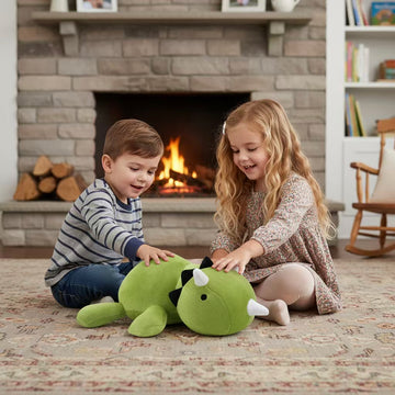 Side view of a green triceratops stuffed animal in a full product display