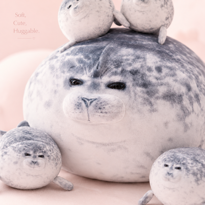 SQEQE seal stuffed animal with babies displayed with four baby seal plush toys on a plain background